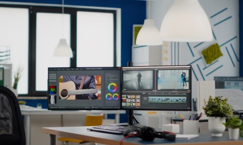 empty-modern-creative-agency-office-with-dual-monitors-setup-with-processing-video-film-montage-vide.jpg