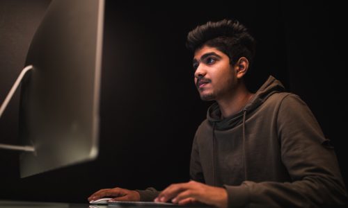 indian-man-hacker-using-computers-stealing-data-desk-1.jpg